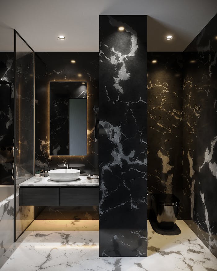 Elegant black marble bathroom featuring contemporary fixtures and stylish design elements.